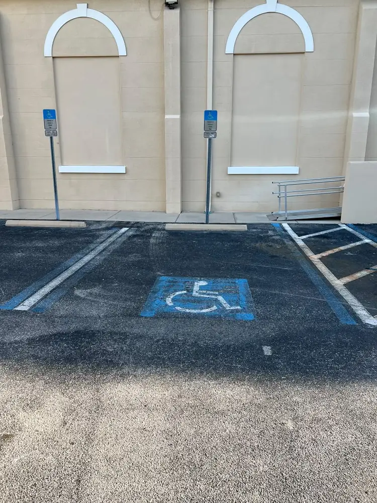 Before - faded ADA handicap parking stall restriping in Tampa Bay, Florida